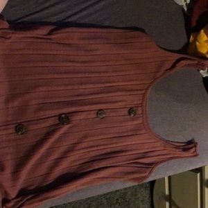 It’s a cute pink button tink top